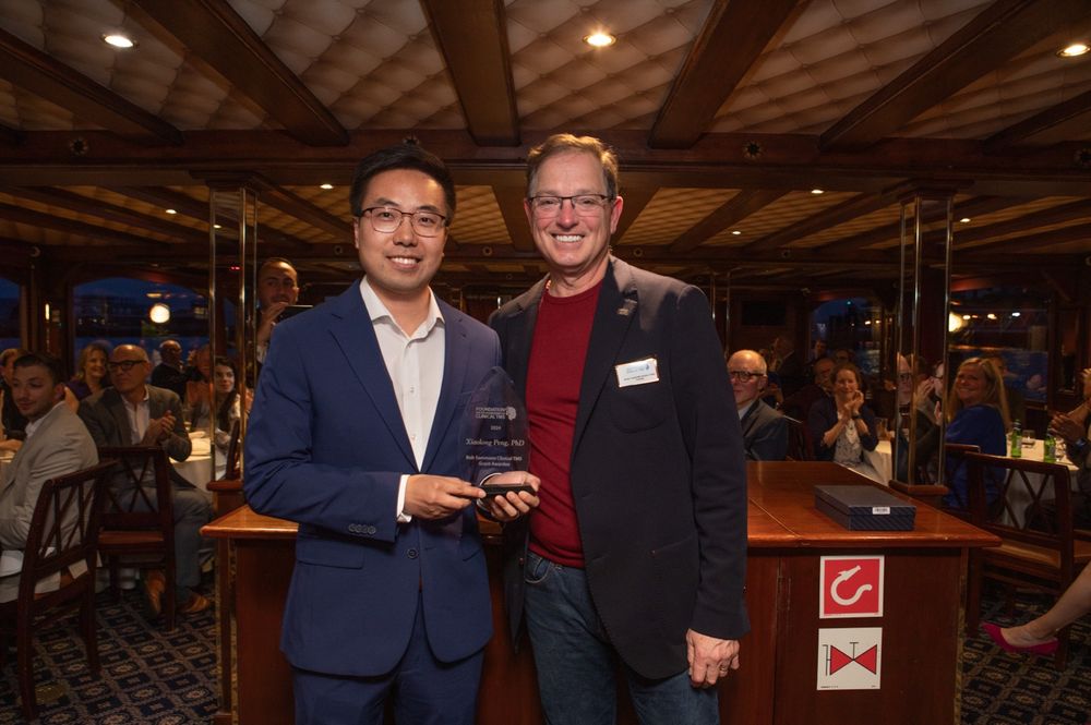 Xiaolong Peng, PhD, receiving the 2024 Bob Sammons Clinical TMS Research Grant